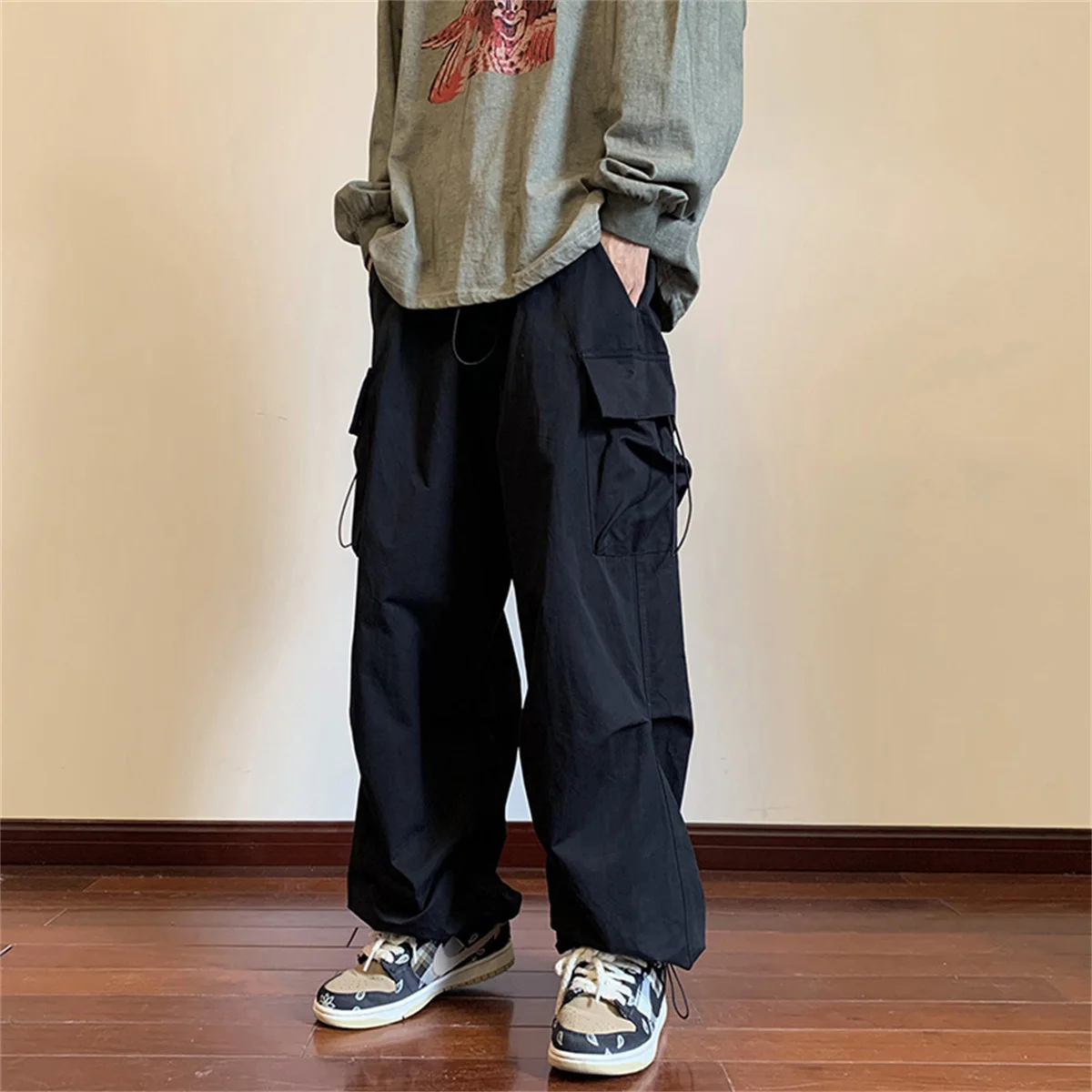 Ropa de calle 2024 primavera Harem pantalones casuales hombres cintura elástica Color sólido pantalones Cargo Multi bolsillo pantalones holgados sueltos para mujeres